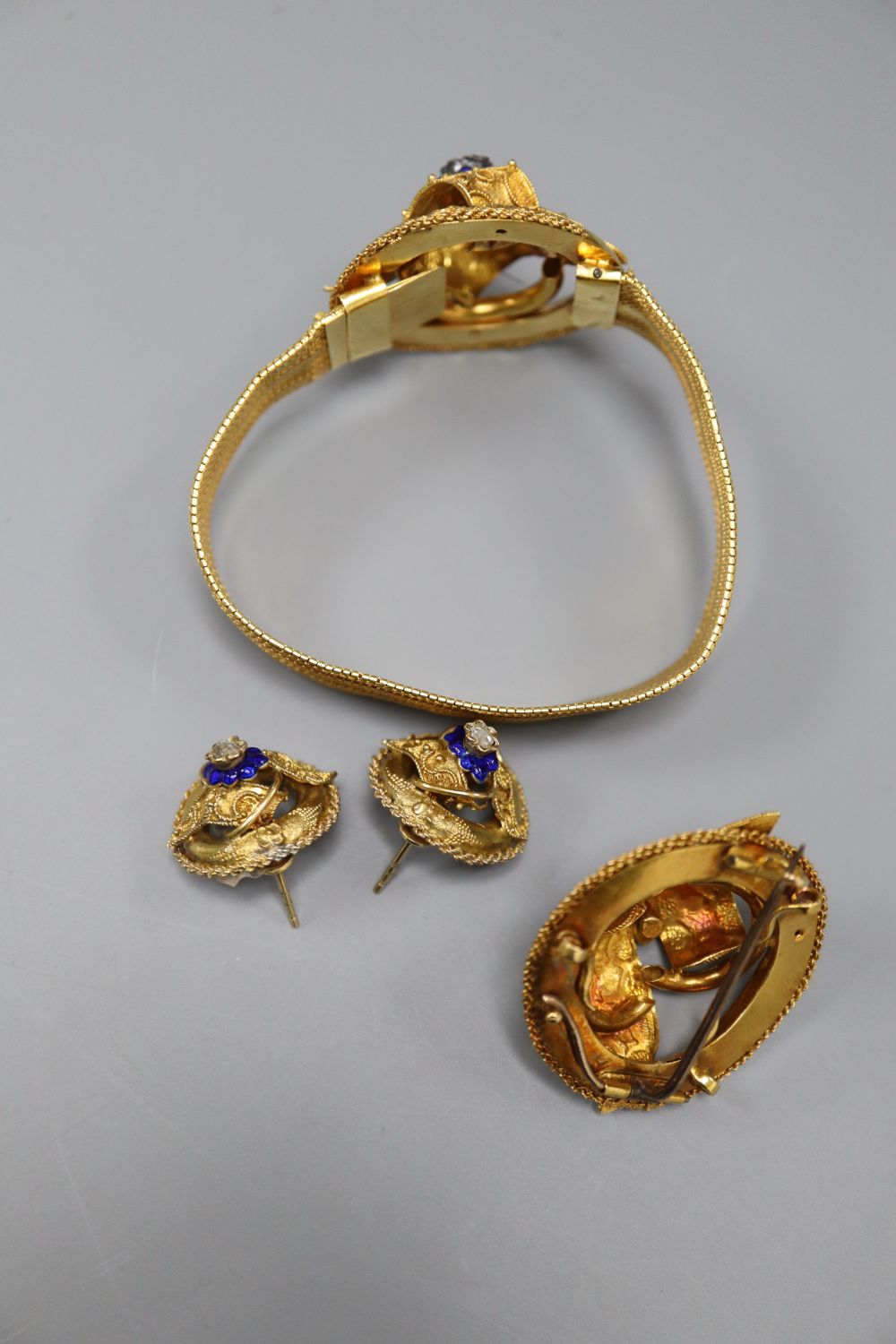A Victorian yellow metal, blue enamel and rose cut diamond set demi parure,